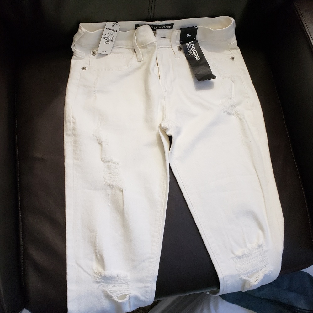 Distressed white jeans